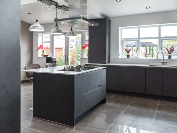 Porcelian tile floors in a modern kitchen with grey cabinets in Dallas tx