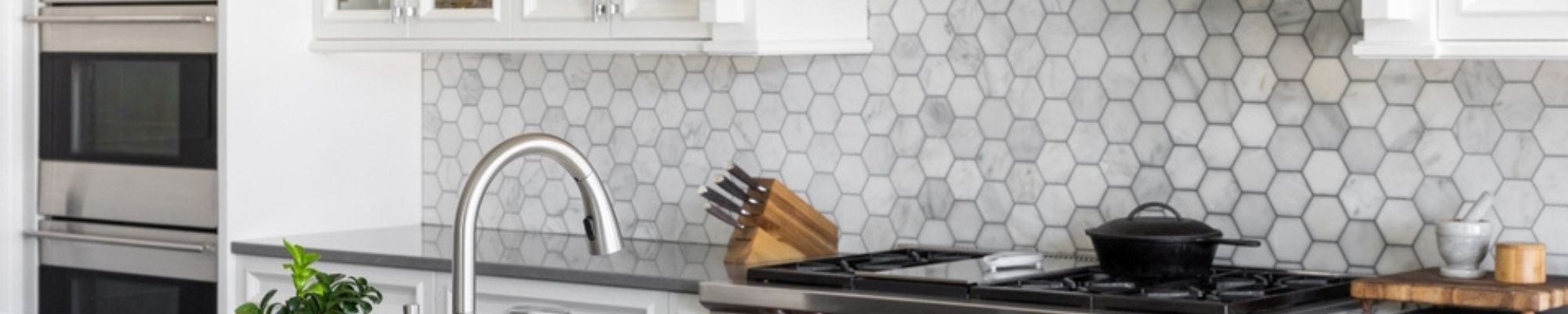 White honeycomb backsplash tile in a bright kitchen