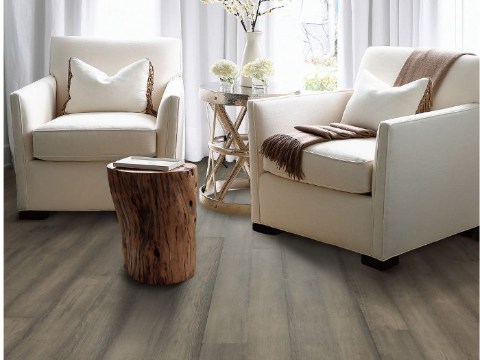 Neutral Grey Brown Hardwood flooring in a traditional seating area