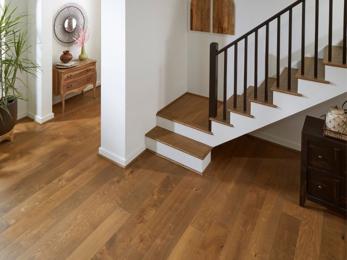 Wooden floors on stairs in an open entryway